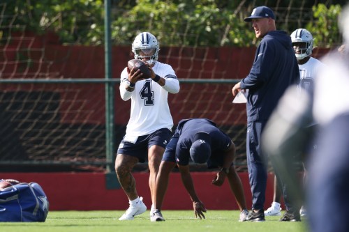 Dallas Cowboys quarterback Dak Prescott (4) works out during a practice for an NFL football game against the Baltimore Ravens in Rio de Janeiro, Friday, Sept. 25, 2026. (AP Photo/Lucas Figueiredo)
