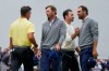 USA teams' Scottie Scheffler, right, and Sam Burns greet International teams' Corey Conners, of Canada, left, and Nick Taylor, of Canada, after their Presidents Cup golf tournament second round foursomes match at Medinah Country Club, Friday, Sept. 25, 2026, in Medinah, Ill. (AP Photo/Chris Carlson)