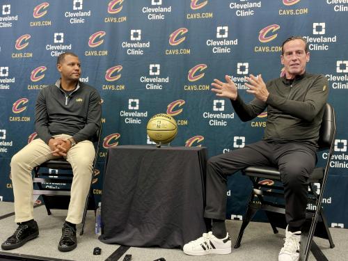 In this photo taken with a smartphone, Koby Altman, left, president of basketball operations for the Cleveland Cavaliers, and head coach Kenny Atkinson discuss the team's offseason moves and preview training camp during an NBA basketball news conference in Independence, Ohio, Friday, Sept. 25, 2026. (AP Photo/Joe Reedy)