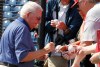 FILE - Philadelphia Phillies chairman Bill Giles signs autographs before a spring training baseball game in Clearwater, Fla., Monday, March 21, 2011. (AP Photo/Gene J. Puskar,File)
