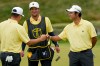 International teams' Hideki Matsuyama, of Japan, right, celebrates with Sungjae Im, of South Korea, on the eighth green against the USA team during the Presidents Cup golf tournament second round foursomes match at Medinah Country Club, Friday, Sept. 25, 2026, in Medinah, Ill. (AP Photo/Chris Carlson)