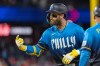 Philadelphia Phillies' Bryce Harper gestures from first base after hitting a single during the sixth inning of a baseball game against the Tampa Bay Rays, Friday, Sept. 25, 2026, in Philadelphia. (AP Photo/Laurence Kesterson)