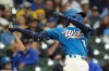 Milwaukee Brewers' Brice Turang hits an RBI double during the first inning of a baseball game against the St. Louis Cardinals, Friday, Sept. 25, 2026, in Milwaukee. (AP Photo/Aaron Gash)