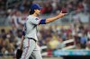 Texas Rangers pitcher Jacob Degrom reacts during the second inning of a baseball game against the Minnesota Twins, Friday, Sept. 25, 2026, in Minneapolis. (AP Photo/Ellen Schmidt)