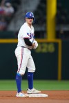 Texas Rangers' Josh Jung stands at second base after hitting a double against the New York Mets during the fourth inning of a baseball game Thursday, Sept. 24, 2026, in Arlington, Texas. (AP Photo/Julio Cortez)