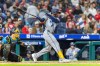 Tampa Bay Rays' Cedric Mullins, right, follows through on a single during the ninth inning of a baseball game against the Philadelphia Phillies, Friday, Sept. 25, 2026, in Philadelphia. (AP Photo/Laurence Kesterson)