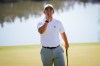 International teams' Tom Kim, of South Korea, reacts after his shot on the 12th green against the USA team during a Presidents Cup golf tournament third round four-ball match at Medinah Country Club, Saturday, Sept. 26, 2026, in Medinah, Ill. (AP Photo/Matt Slocum)