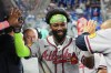 Atlanta Braves' Michael Harris II is congratulated after scoring on a sacrifice fly hit by Matt Olson during the first inning of a baseball game against the Miami Marlins, Saturday, Sept. 26, 2026, in Miami. (AP Photo/Lynne Sladky)