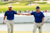 USA teams' Chris Gotterup, right, celebrates with Cameron Young against the International team during a Presidents Cup golf tournament third round foursome match at Medinah Country Club, Saturday, Sept. 26, 2026, in Medinah, Ill. (AP Photo/Chris Carlson)