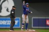 Texas Rangers' Brandon Nimmo celebrates after hitting an RBI-double during the second inning of a baseball game against the Minnesota Twins Saturday, Sept. 26, 2026, in Minneapolis. (AP Photo/Abbie Parr)