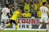 Nashville SC forward Hany Mukhtar (10) scores their opening goal past Toronto FC defender Nicksoen Gomis (15) during the first half of an MLS soccer match Saturday, Sept. 26, 2026, in Nashville, Tenn. (AP Photo/George Walker IV)