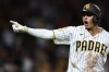 San Diego Padres' Manny Machado celebrates after his three-run home run in the fourth inning of a baseball game against the Arizona Diamondbacks, Saturday, Sept. 26, 2026, in San Diego. (AP Photo/Karl Anderson)