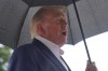 President Donald Trump talks to reporters on the South Lawn of the White House before boarding Marine One, Sunday, Sept. 27, 2026, in Washington. (AP Photo/Allison Robbert)