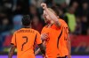 Netherlands' Mexx Meerdink celebrates with' Crysencio Summerville, left, after scoring his side's second goal during the Nations League soccer match between Serbia and the Netherlands in Belgrade, Serbia, Sunday, Sept. 27, 2026. (AP Photo/Darko Vojinovic)