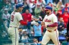 Philadelphia Phillies designated hitter Kyle Schwarber, right, is cheered by Alec Bohm, left, after scoring on an RBI double by Bryson Stott during the first inning of a baseball game against the Tampa Bay Rays, Sunday, Sept. 27, 2026, in Philadelphia. (AP Photo/Laurence Kesterson)