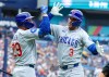 Chicago Cubs designated hitter Alex Bregman (3) celebrates with teammate Michael Busch (29) after hitting his second home run of a baseball game in the third inning against the Boston Red Sox, Sunday, Sept. 27, 2026, in St. Petersburg, Fla. (AP Photo/Chris Urso)