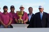 President Donald Trump, right, poses with members of the USA team after presenting them with the Presidents Cup trophy at the Presidents Cup golf tournament at Medinah Country Club, Sunday, Sept. 27, 2026, in Medinah, Ill. (AP Photo/Julia Demaree Nikhinson)