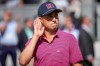 USA teams' Justin Thomas motions to the fans prior to the start of the Presidents Cup golf tournament final round singles match against the International team at Medinah Country Club, Sunday, Sept. 27, 2026, in Medinah, Ill. (AP Photo/Matt Slocum)