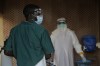 A healthcare worker is disinfected by his colleague inside a treatment center for Ebola patients in Beni, North Kivu province, eastern Congo, Saturday, Sept. 26, 2026. (AP Photo/Sebastien Kitsa Musayi)