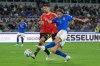 Italy's Pio Esposito, right, attempts a shot at goal next to Belgium's Brandon Mechele during the Nations League soccer match between Italy and Belgium in Rome, Friday, Sept. 25, 2026. (AP Photo/Andrew Medichini)