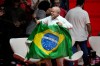 Brazilian President Luiz Inacio Lula da Silva, who is running for reelection, arrives carrying a Brazilian flag to attend a campaign rally with artists in Rio de Janeiro, Brazil, Wednesday, Sept. 23, 2026. (AP Photo/Silvia Izquierdo)
