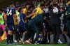 Players scuffle on the side lines during the international friendly soccer match between Australia and Brazil in Brisbane, Australia, on Tuesday, Sept. 29, 2026. (AP Photo/Tertius Pickard)