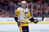 FILE - Pittsburgh Penguins' Sidney Crosby looks on during a break in Game 6 in the first round of the NHL hockey Stanley Cup playoffs series, April 29, 2026, in Philadelphia. (AP Photo/Matt Slocum, File)