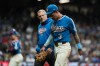 Milwaukee Brewers' Joey Ortiz exits the field with a trainer after suffering an injury during the eighth inning of a baseball game against the St. Louis Cardinals, Friday, Sept. 25, 2026, in Milwaukee. (AP Photo/Aaron Gash)