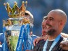 FILE - Manchester City coach Pep Guardiola lifts the English Premier League trophy after the English Premier League soccer match between Brighton and Manchester City at the AMEX Stadium in Brighton, England, Sunday, May 12, 2019. (AP Photo/Frank Augstein, File)