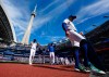 Blue Jays designated hitter George Springer (4) walks off the field before the start of a Major League Baseball game against the Cincinnati Reds in Toronto on Sept. 27, 2026. THE CANADIAN PRESS/Frank Gunn