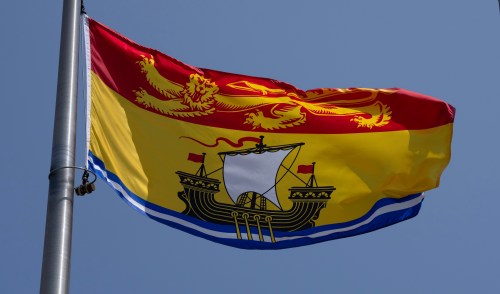The  New Brunswick provincial flag flies on a flagpole in Ottawa, Friday, July 24, 2026 in Ottawa.  THE CANADIAN PRESS/Adrian Wyld