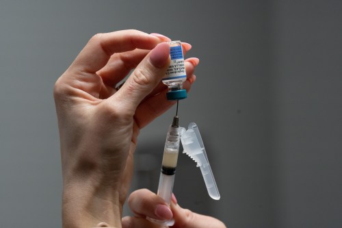 FILE - A nurse, prepares a combination measles, mumps and rubella vaccine for a patient at a pediatrics clinic in Easley, S.C., March 17, 2026. (AP Photo/Mary Conlon, File)