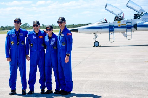 The crew for the upcoming NASA SpaceX launch, from left, Sergey Teteryatnikov, of Russia, pilot Luke Delaney, commander Jessica Watkins and Joshua Kutryk, of Canada, pose for a photo at a news conference after arriving at the Kennedy Space Center in Cape Canaveral, Fla., Saturday, Sept. 26, 2026. (AP Photo/John Raoux)