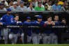 The Chicago Cubs dugout watches in the seventh inning against the San Diego Padres in Game 2 of the National League Wild Card baseball playoff series Wednesday, Sept. 30, 2026, in San Diego. (AP Photo/Gregory Bull)