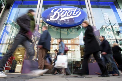 People walk past a Boots pharmacy on Oxford street in central London, Monday, Oct. 3, 2005. (AP Photo/SergioDionisio)