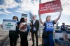 Manitoba Association of Health Care Professionals president Jason Linklater, centre, joins striking members of Manitoba’s private lab services provider Dynacare, on the picket line in Winnipeg, Tuesday, Sept. 8, 2026. THE CANADIAN PRESS/John Woods