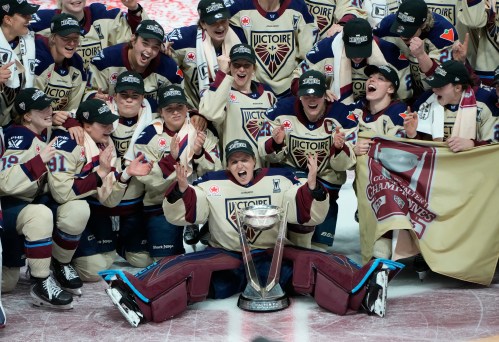 Montreal Victoire players pose for a team photo after defeating the Ottawa Charge to win the PWHL Walter Cup final in Ottawa on May 20, 2026. THE CANADIAN PRESS/Adrian Wyld