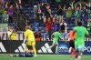 Seattle Sounders midfielder Cristian Roldan (7) celebrates scoring against Sporting Kansas City goalkeeper Stefan Cleveland (30) during the second half of an MLS soccer match, Thursday, Oct. 1, 2026, in Seattle. (AP Photo/Lindsey Wasson)