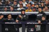 New York Yankees' Aaron Judge, center, watches the game from the dugout railing during the sixth inning in Game 2 of baseball's American League Wild Card Series against the Boston Red Sox, Wednesday, Sept. 30, 2026, in New York. (AP Photo/Frank Franklin II)