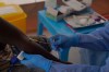 A doctor collects an enrolled patient's blood for Ebola testing during clinical trials attempting to stop the rare Bundibugyo virus, amidst a deadly Ebola outbreak, in Rwampara Hospital in Ituri, Congo, Thursday, Oct. 1, 2026. (AP Photo/Dieudonne Dirole)