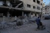 Palestinians inspect the site of an early morning Israeli airstrike in Gaza city, Saturday, Oct. 3, 2026. (AP Photo/Jehad Alshrafi)