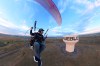 In this image taken from video provided by Jacob Hutzler shows Hutzler flies his paramotor to work as an air traffic controller in Pueblo, Colo., on Aug. 13, 2026. (Jacob Hutzler via AP)