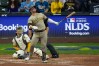 San Diego Padres' Ty France watches his ball hit a cable near the roof of American Family Field during the ninth inning of Game 1 of a National League Divisional baseball playoff series Sunday, Oct. 4, 2026, in Milwaukee. (AP Photo/Chris Carlson)