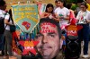 Supporters of Brazilian President Luiz Inacio Lula da Silva, who is running for reelection, display a large-headed effigy of presidential candidate Flavio Bolsonaro with a message in Portuguese that reads 