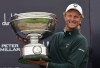 Adrian Meronk of Poland holds the trophy after winning the Alfred Dunhill Links Championship 2026 at the Old Course at St Andrews, Scotland, Sunday Oct. 4, 2026. (Steve Welsh/PA via AP)