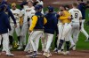 Milwaukee Brewers' Jackson Chourio is congratulated after hitting a walkoff hit during the ninth inning of Game 2 of a National League Divisional baseball playoff series against the San Diego Padres Sunday, Oct. 4, 2026, in Milwaukee. (AP Photo/Chris Carlson)