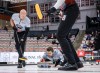 Team Dunstone skip Matt Dunstone, centre, makes a shot as teammates Ryan Harnden, left, and EJ Harnden sweep against Team Jacobs during the men's final at the PointsBet Invitational in Calgary on Oct. 5, 2025. THE CANADIAN PRESS/Jeff McIntosh