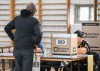 A person waits to vote on election day in Montreal, Monday, Oct. 5, 2026. THE CANADIAN PRESS/Graham Hughes