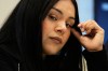 Marimar Martinez, a Chicago woman who was shot by a Border Patrol agent last year, listens to attorney Christopher Parente at a press conference Monday, Oct. 5, 2026, in Chicago. (AP Photo/Nam Y. Huh)