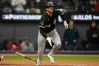 Chicago White Sox's Braden Montgomery (24) watches his 2-run double during the sixth inning of Game 2 of baseball's American League Division Series against the Cleveland Guardians, Monday, Oct. 5, 2026, in Cleveland. (AP Photo/Sue Ogrocki)